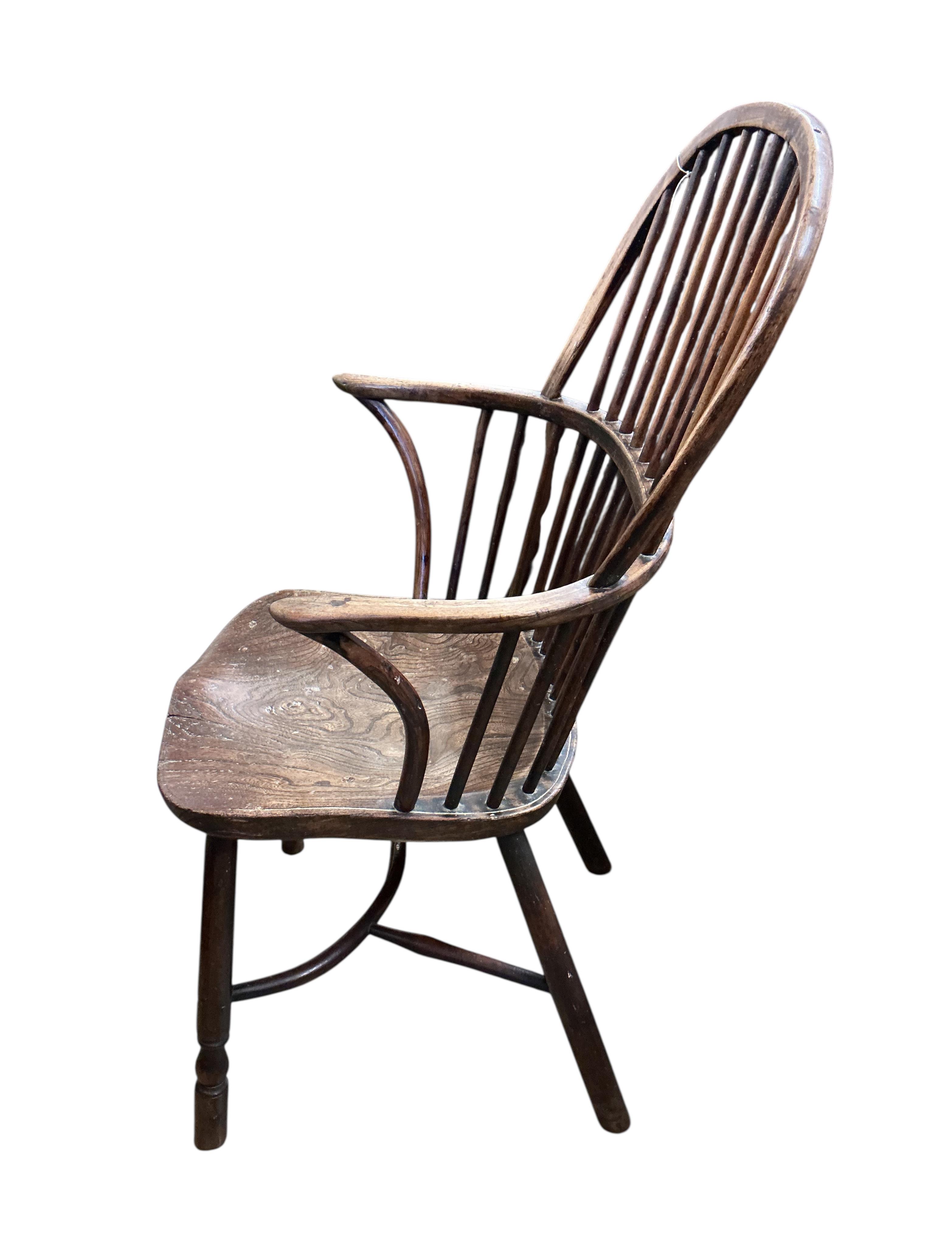 A 19th century ash, elm and beech Windsor comb back with crinoline stretcher armchair, width 57cm, depth 43cm, height 102cm